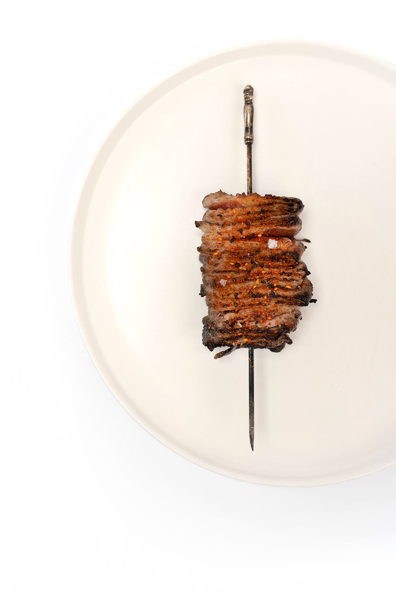 Skewer of thinly sliced grilled duck breast | Gastronomixs