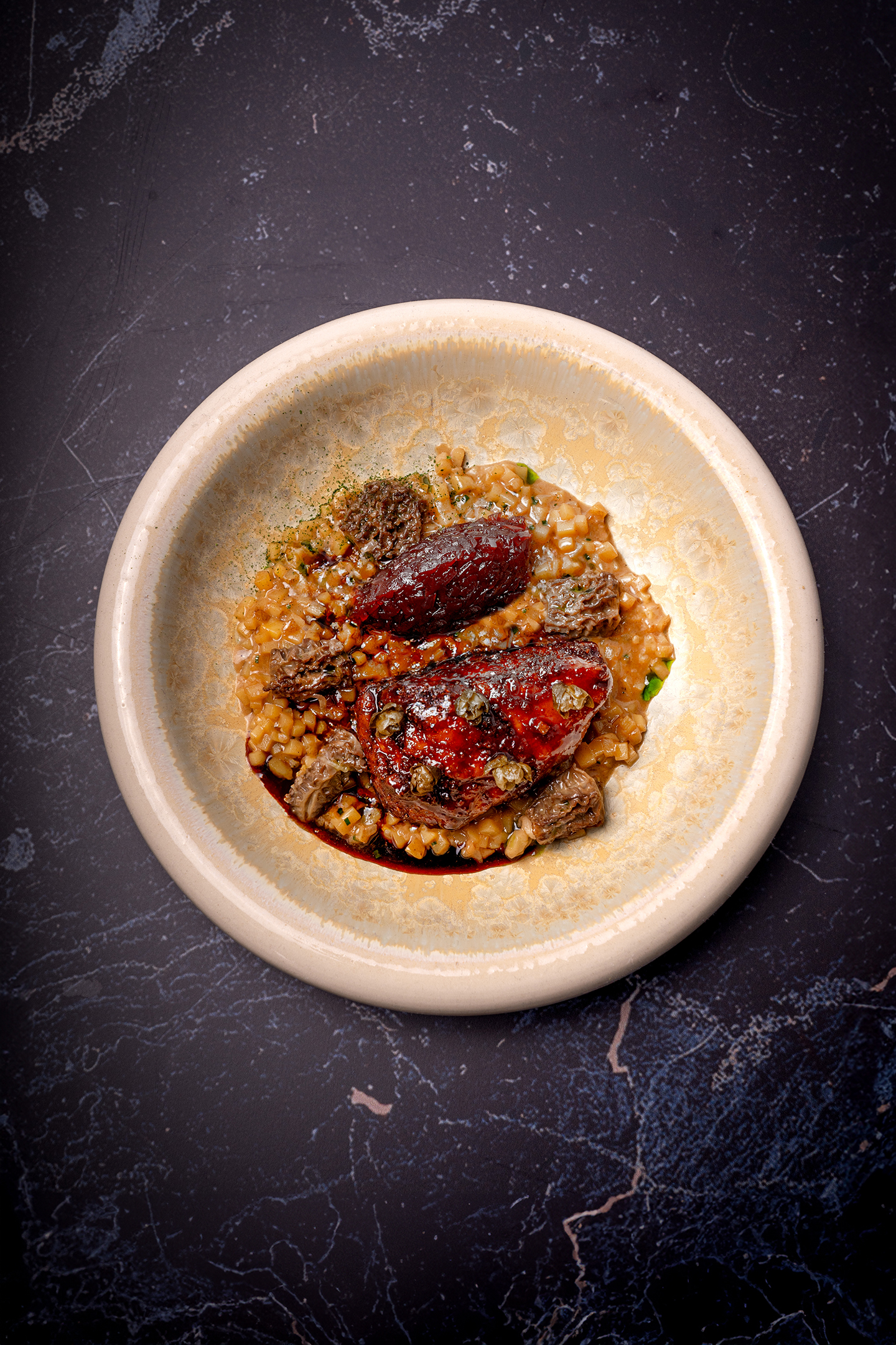 Potato risotto with cèpes, sweetbread and smoked red onion compote