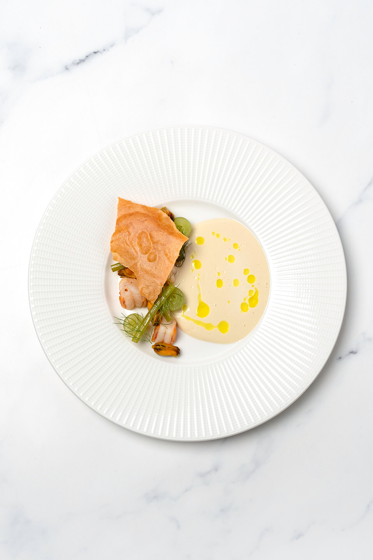 Ajo blanco with roasted garlic, prawns, mussels, mini fennel and tuile of ajo de Andalucia and prawns