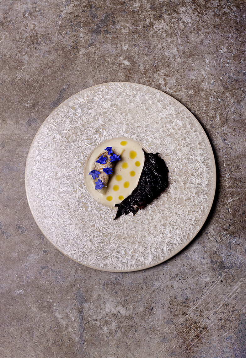 Oriental tartare with smoked oyster and hazelnut and wasabi milk