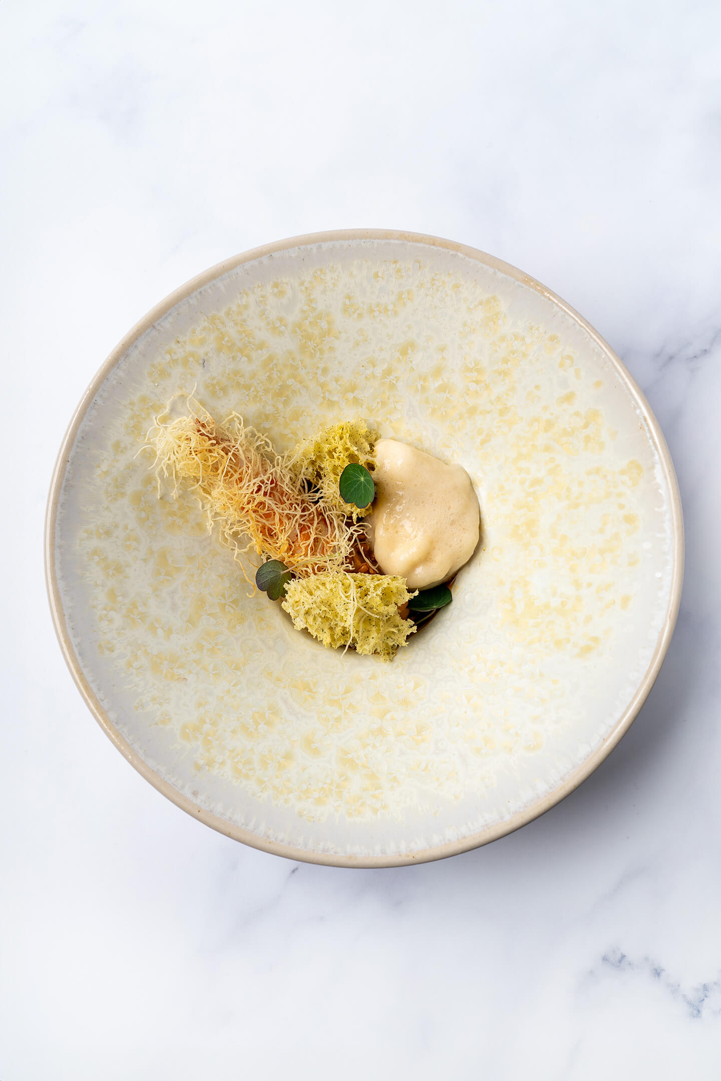 Langoustine met structuren van pompoen, pumpkin spice espuma en kalamansi